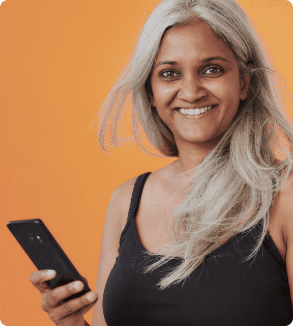 An image with an orange background and a woman holding a phone